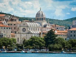 a large building with a dome on top of a city at Villa Adriatic Sunrise in Šibenik