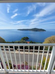 a view of the ocean from a balcony at Apartments Sv.Jakov in Dubrovnik