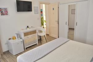 Posteľ alebo postele v izbe v ubytovaní B&B Rosa dei Venti