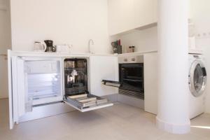 Kuchnia lub aneks kuchenny w obiekcie MEDANO4YOU White Dream Penthouse
