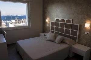 Posteľ alebo postele v izbe v ubytovaní B&B Ghalà