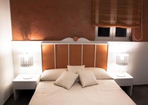 Posteľ alebo postele v izbe v ubytovaní B&B Ghalà