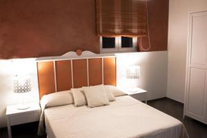 Posteľ alebo postele v izbe v ubytovaní B&B Ghalà
