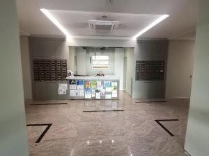 a large room with a counter in a building at Hill Dreams Lux in Belgrade