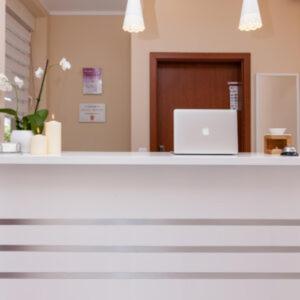 a desk with a laptop computer on top of it at Villa Puerto in Pobierowo