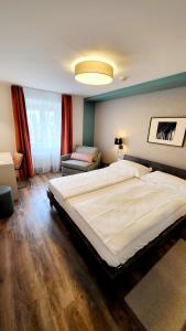 Voodi või voodid majutusasutuse Hotel Pestalozzi Lugano toas +37 fotot