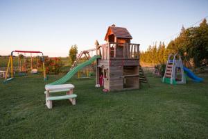 a playground with a slide and a play structure at Agriturismo Terralieta in Roseto degli Abruzzi