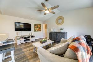a living room with a couch and a flat screen tv at Updated Hubert Vacation Rental 5 Mi to Beaches! in Swansboro