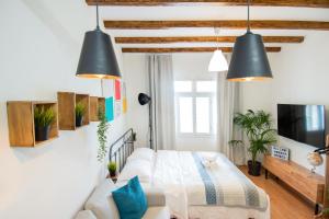 a living room with a bed and a couch at Cozy House Old Town Xanthi - MenoHomes 1 in Xanthi