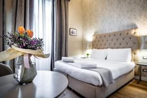 Letto o letti in una camera di Martelli 6 Suite & Apartments