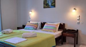 Postel nebo postele na pokoji v ubytování Hotel Mochlos
