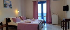 Postel nebo postele na pokoji v ubytování Hotel Mochlos