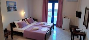 Postel nebo postele na pokoji v ubytování Hotel Mochlos