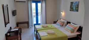 Postel nebo postele na pokoji v ubytování Hotel Mochlos