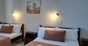 Postel nebo postele na pokoji v ubytování Hotel Mochlos