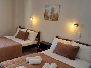 Postel nebo postele na pokoji v ubytování Hotel Mochlos