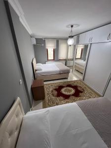 Säng eller sängar i ett rum på Villa trabzon