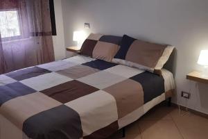 Postel nebo postele na pokoji v ubytování Casa Poseidonia - intero alloggio in riva al mare