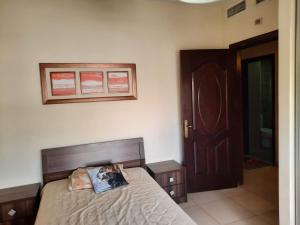 Cama o camas de una habitación en Furnished apartment for rent In Abdoun شقة مفروشة للايجار في عبدون