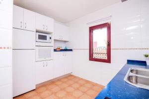 A kitchen or kitchenette at Villa Tropical Private Pool Capellania By Holidays Home