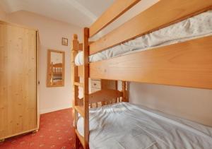 a couple of bunk beds in a room at Dee Mount in Carrog