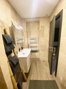 a small bathroom with a sink and a toilet at L'AGACHON LA CIOTAT VIEUX PORT in La Ciotat +12 photos