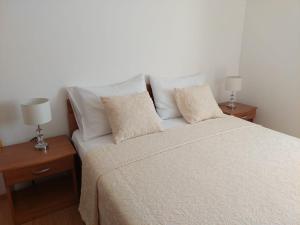 Postel nebo postele na pokoji v ubytování Apartments Zulim
