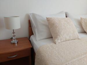 Postel nebo postele na pokoji v ubytování Apartments Zulim