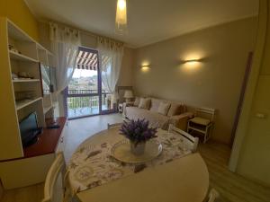 a living room with a table and a couch at Sara by PortofinoVacanze in Rapallo