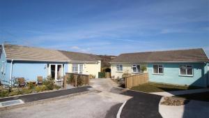 a couple of houses in a street at Granny Shells in The Mumbles