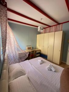 a bedroom with a bed with a mosquito net at 3 Bedroom Apartment in Tirana