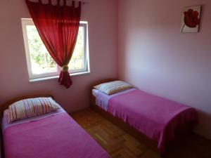 Postel nebo postele na pokoji v ubytování Apartments Jana