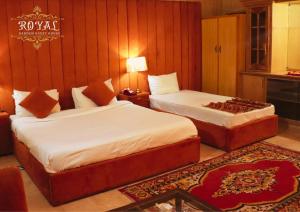 a hotel room with two beds at Royal Garden in Islamabad