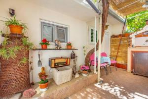 a living room with a fireplace and a table at Studio Ibis in Dubrovnik