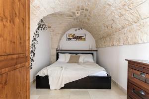 Ένα ή περισσότερα κρεβάτια σε δωμάτιο στο La Terrazza del Professore by Wonderful Italy