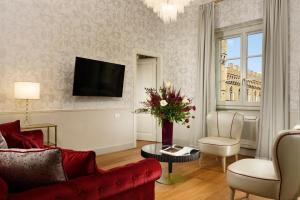Televízia a/alebo spoločenská miestnosť v ubytovaní San Firenze Suites & Spa