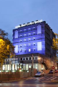 a blue building with a sign on top of it at Zenit Conde de Orgaz in Madrid