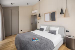Postel nebo postele na pokoji v ubytování Design Villa Palmeta