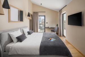 Postel nebo postele na pokoji v ubytování Design Villa Palmeta