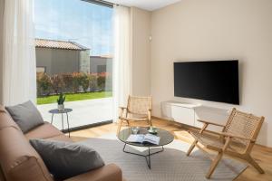 TV a/nebo společenská místnost v ubytování Design Villa Palmeta