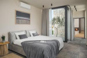 Postel nebo postele na pokoji v ubytování Design Villa Palmeta + 24 fotografií