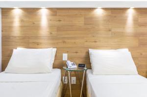 Postel nebo postele na pokoji v ubytování Hotel Costamar Ponta Verde