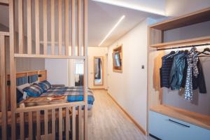 a bedroom with a bunk bed and a closet at Il Sogno in Avio