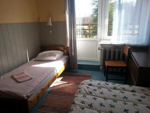 Postel nebo postele na pokoji v ubytování Katri Guesthouse