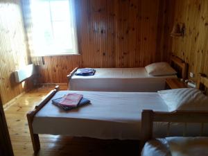 Postel nebo postele na pokoji v ubytování Katri Guesthouse