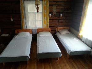Postel nebo postele na pokoji v ubytování Katri Guesthouse