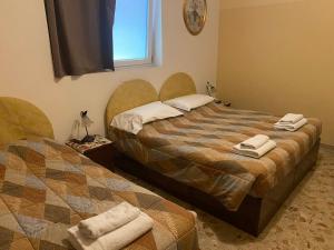Postel nebo postele na pokoji v ubytování B&B Anna Fiera
