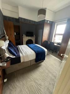 a bedroom with a bed and a living room at Upstairs Studio - Private kitchenette and Small en-suite in Dublin