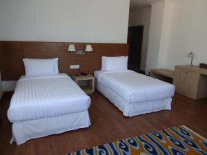 Postel nebo postele na pokoji v ubytování Hotel Osel