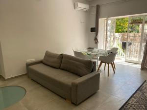 a living room with a couch and a table at Casa Wanda - Restyled 2026 Edition Holiday Home, Ischia Center in Ischia Town